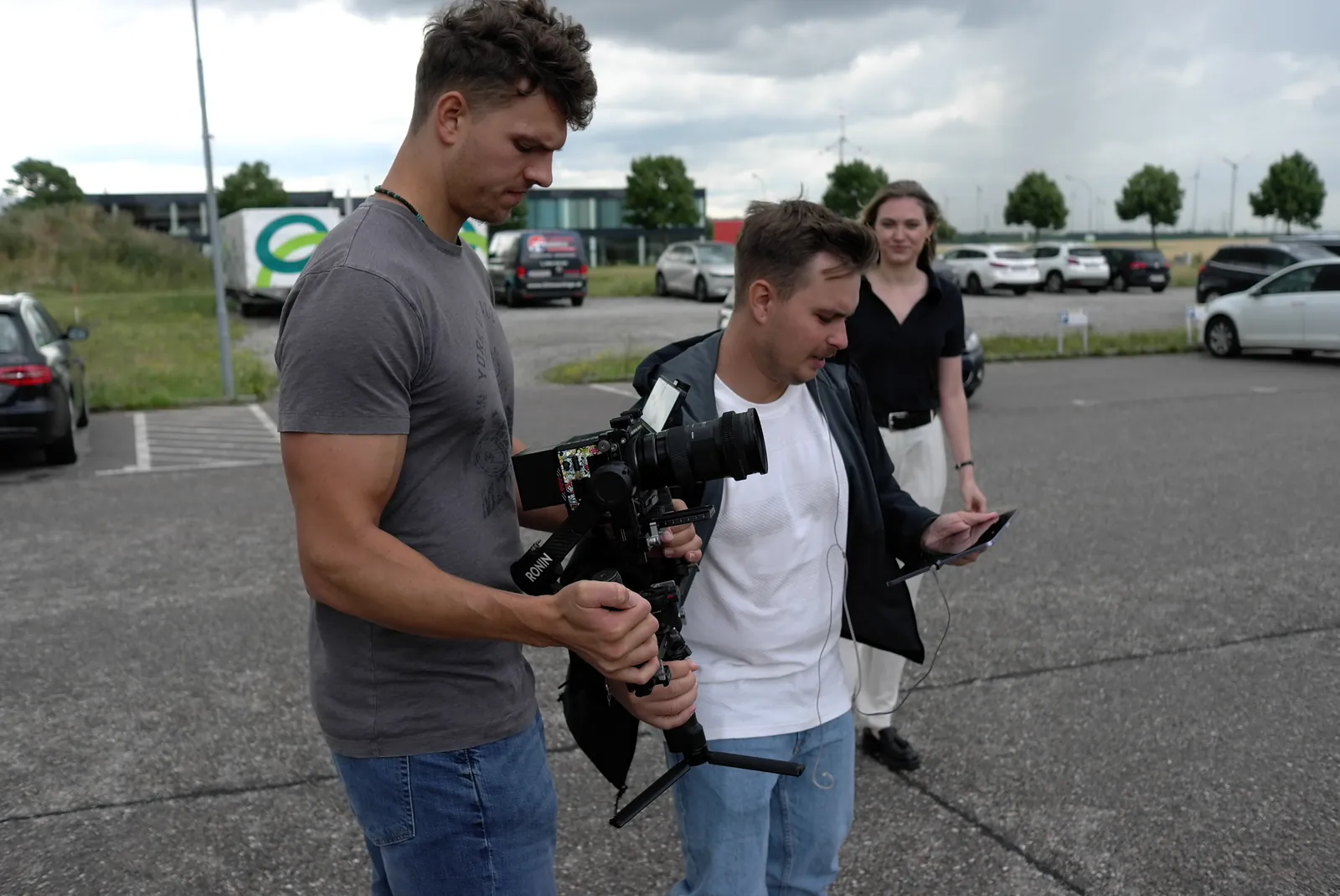 Dennis on set with a camera crew and gimbal in a car park