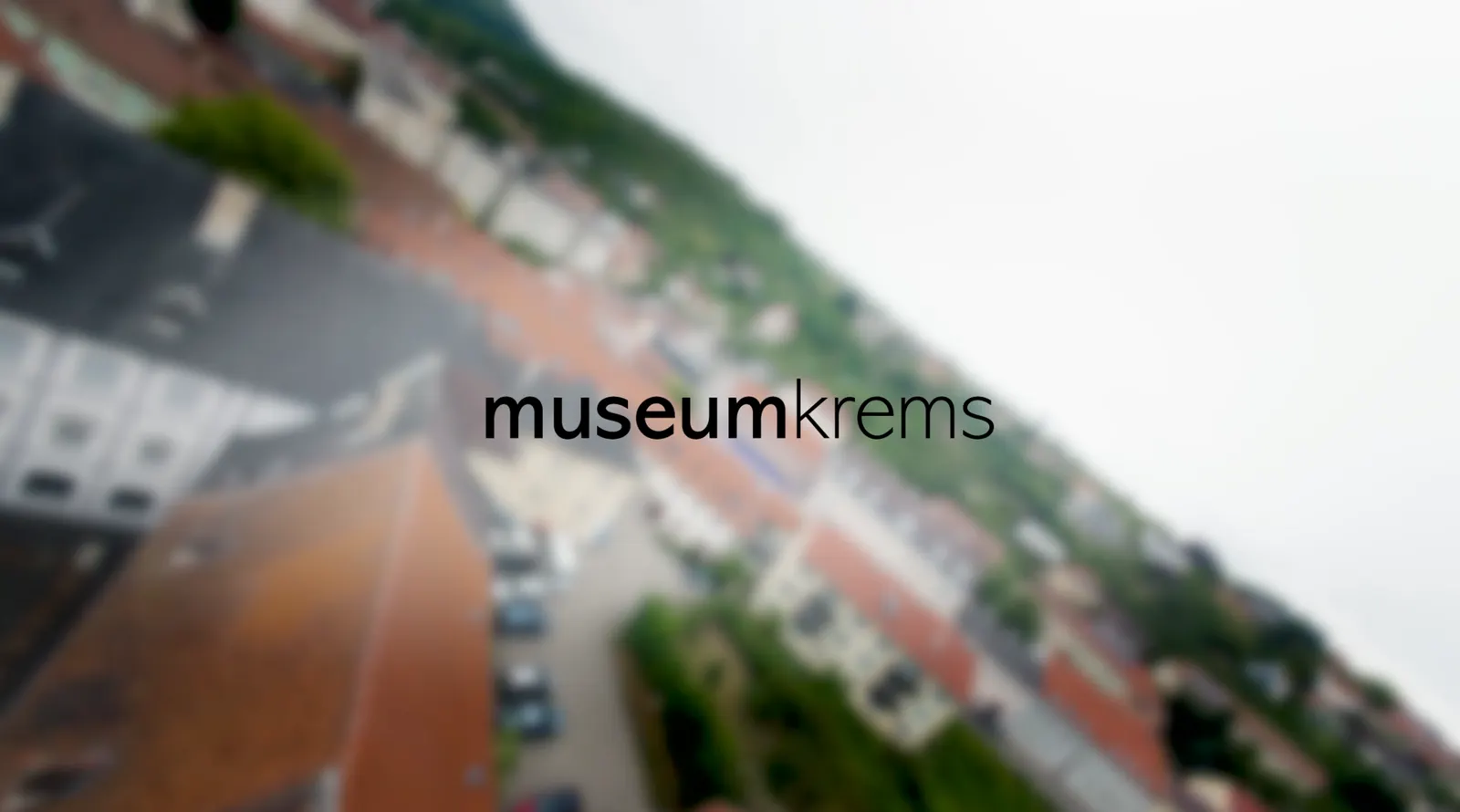 Drone flight over the rooftops of Krems with the museumkrems lettering, cinema spot